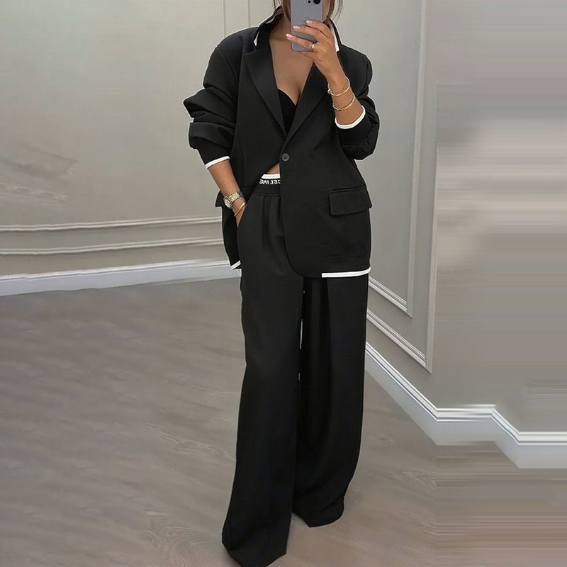 Elegant Byxdräkt för Kvinnor – Oversized Kavaj & Vida Byxor för En Stilren Look