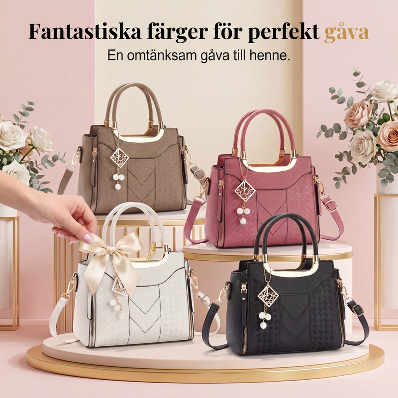 Elegant handväska med flera fack och axelrem