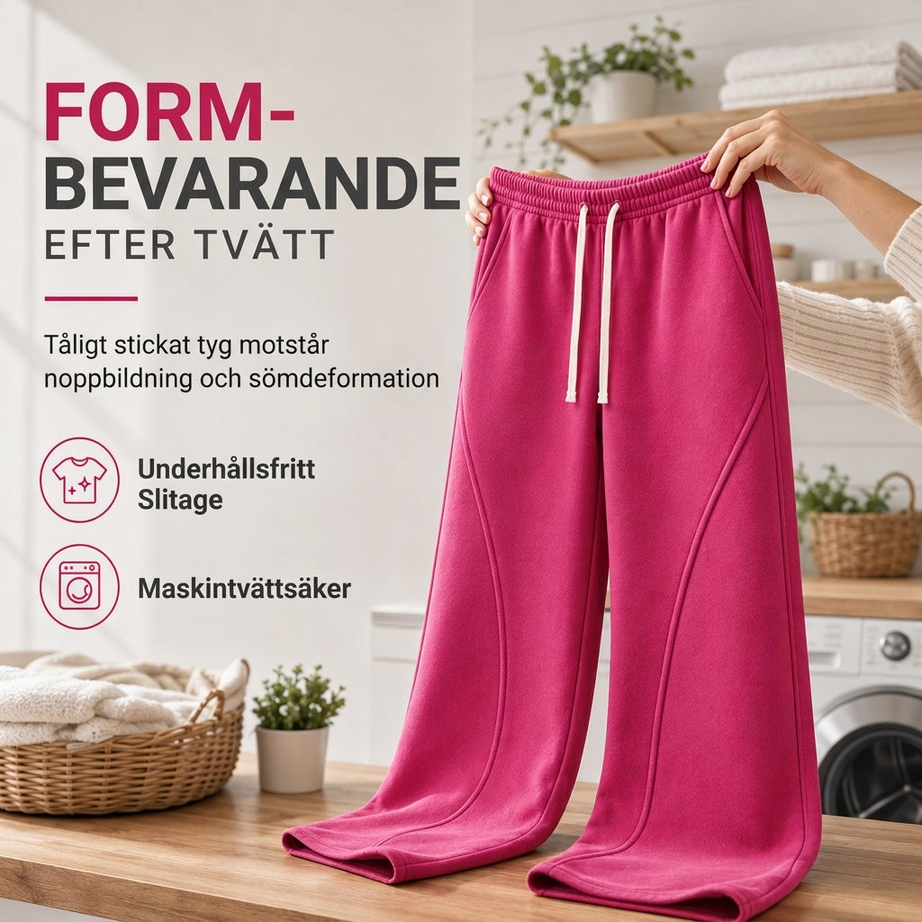 Damhögmidjade vida myrbyxor med böjda sömmar och fickor
